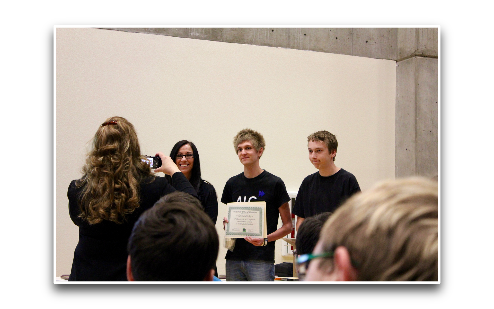 Tyler Hendrickson receiving an award at a ceremony